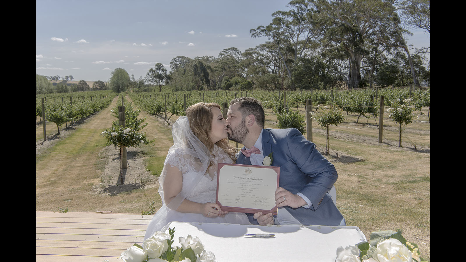 bride and groom first kiss
